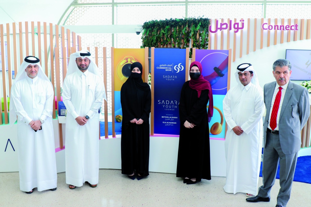 Nayef Al Beshri, AGM and Head of Branches, Commercial Bank with officials and students in the Sadara Youth lounge at the Qatar University Metro Station Branch.