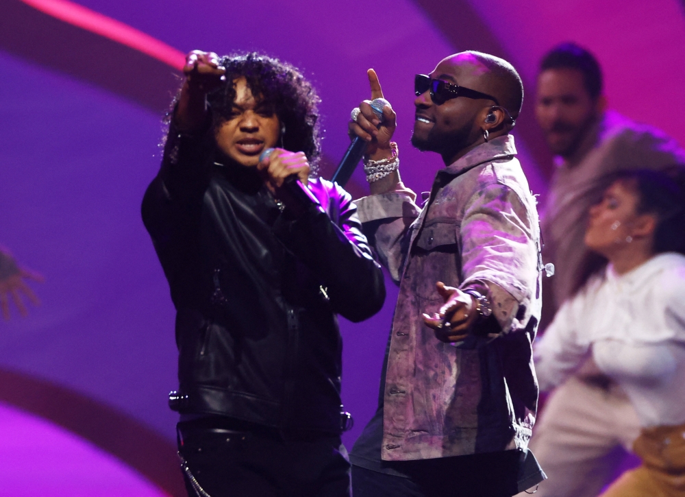 Trinidad Cardona and Davido perform Hayya Hayya, Better Together during the draw Reuters/Kai Pfaffenbach