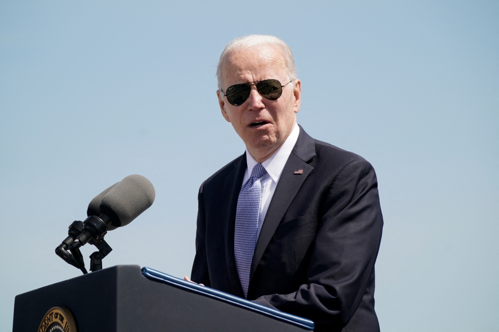 U.S. President Joe Biden introduces his wife Jill Biden at a commemorative commissioning ceremony for the USS Delaware nuclear submarine at the Port of Wilmington, Delaware, U.S., April 2, 2022. REUTERS/Elizabeth Frantz