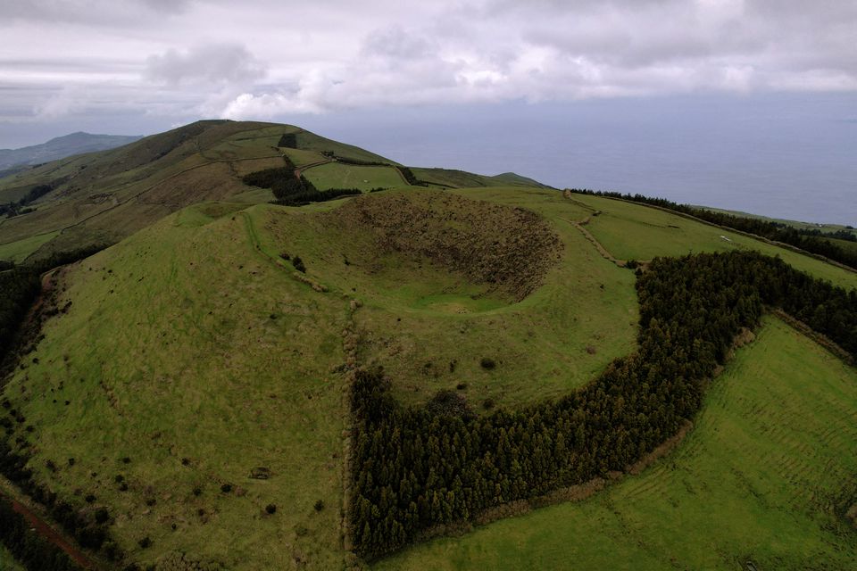 An aerial view shows a volcano crater near Velas as small earthquakes have been recorded on Sao Jorge island, Azores, Portugal, March 30, 2022. Picture taken with a drone. REUTERS/Pedro Nunes/File Photo

