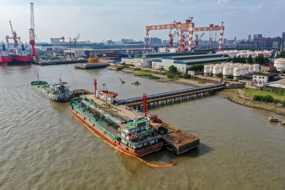 Oil tankers are seen at a terminal of Sinopec Yaogang oil depot in Nantong, Jiangsu province, China June 11, 2019. REUTERS/Stringer

