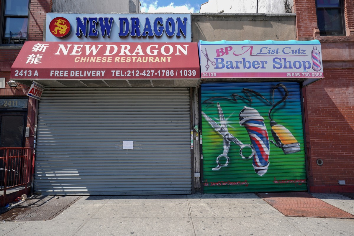 A Chinese restaurant and barber shop in Harlem are closed, as retail sales suffer record drop during the outbreak of the coronavirus disease (COVID-19) in New York City, New York, U.S., April 15, 2020. REUTERS/Bryan R Smith/

