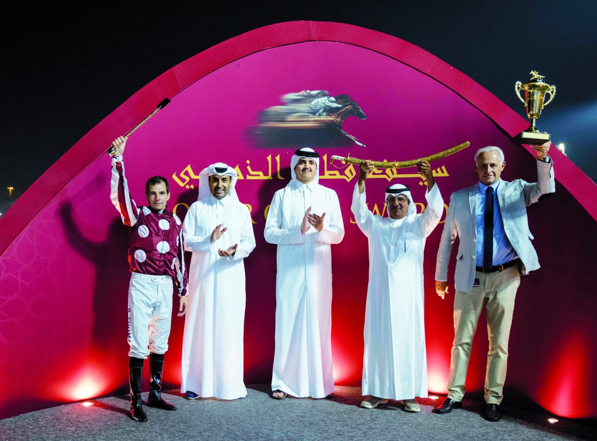 H E Sheikh Thani bin Hamad Al Thani presented the Qatar Gold Sword to Abdulla Rashid Al Kubaisi, who was representing Umm Qarn, owner of Abbes.