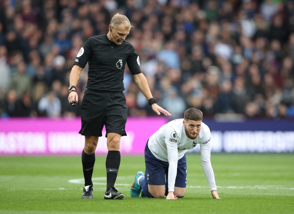 April 9, 2022 Tottenham Hotspur's Matt Doherty goes down as the referee Graham Scott looks on Action Images via Reuters/Molly Darlington