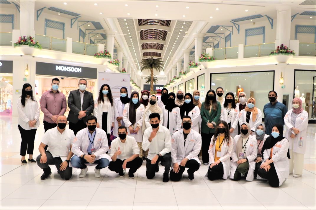 A group photo of Qatar University pharmacy students at Landmark Mall.  