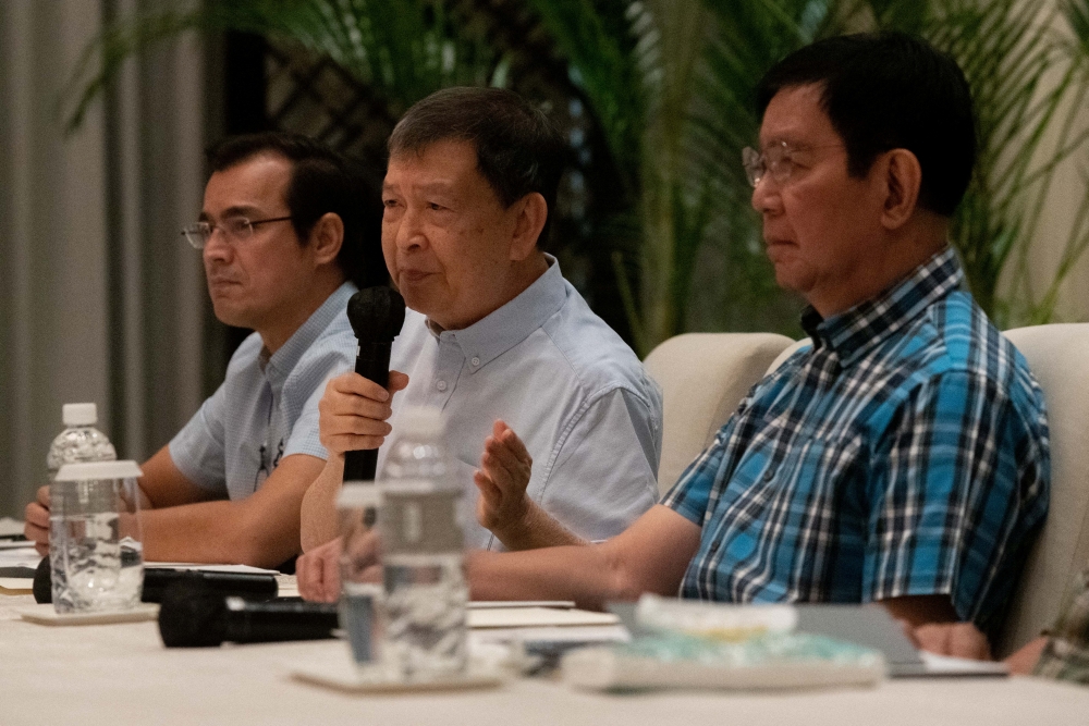 Former Defense Secretary Norberto Gonzales speaks during a joint news conference with Manila City Mayor Francisco 