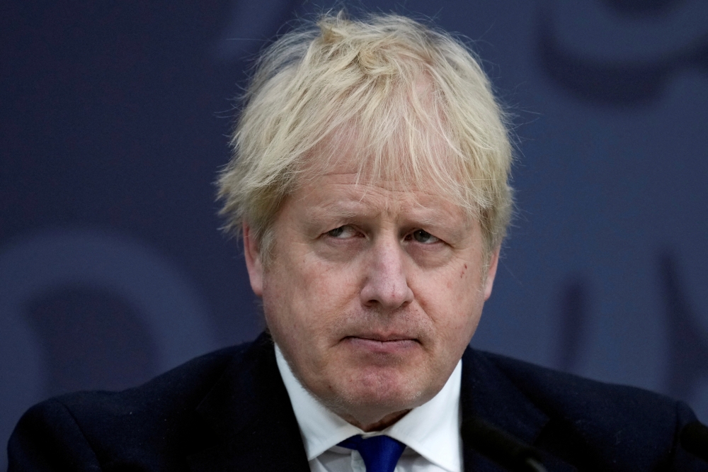 British Prime Minister Boris Johnson looks on while delivering a speech on immigration, at Lydd Airport, Britain April 14, 2022. Matt Dunham/Pool via REUTERS/File Photo