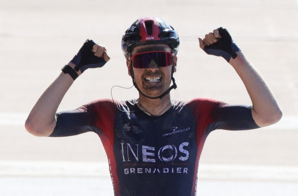 April 17, 2022 Ineos Grenadiers rider Dylan van Baarle of the Netherlands celebrates as he crosses the line to win the race REUTERS/Pascal Rossignol