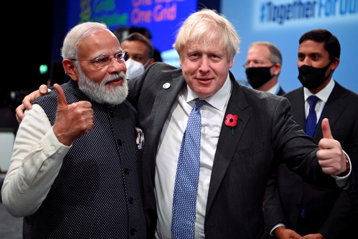 FILE PHOTO: Britain's Prime Minister Boris Johnson and India's Prime Minister Narendra Modi. Jeff J Mitchell/Pool via REUTERS/File Photo
