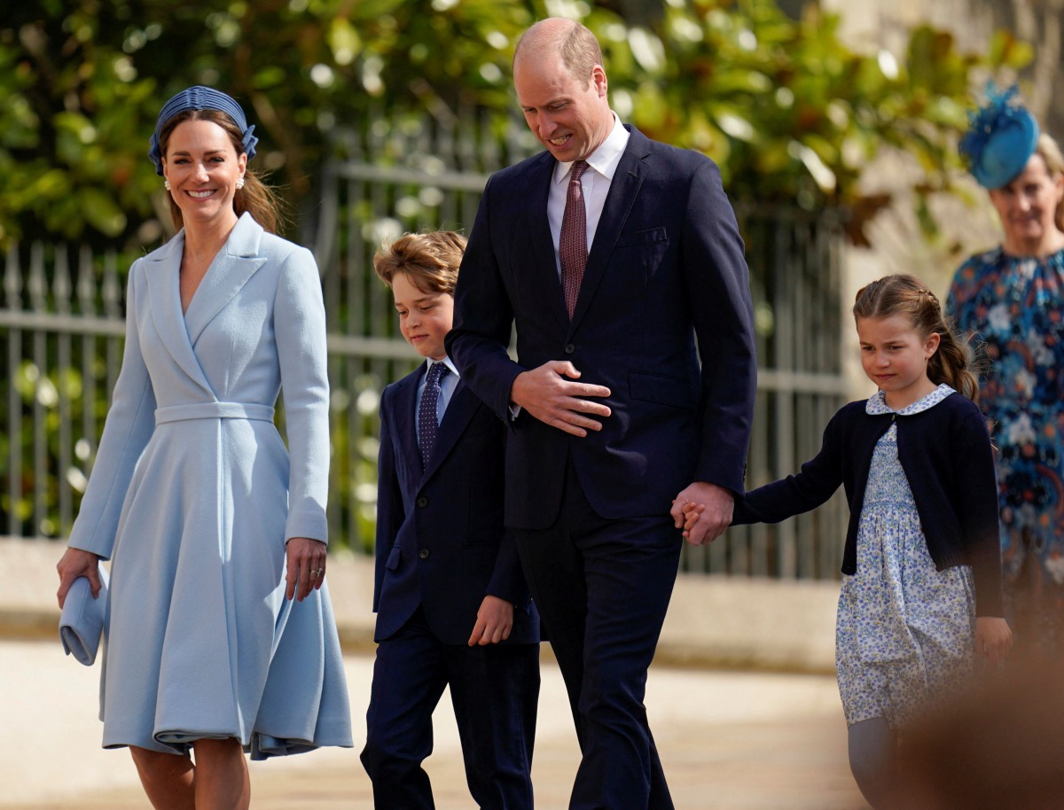 Britain's Prince William and Catherine, Duchess of Cambridge, walk with Prince George and Princess Charlotte as they arrive for the Easter Mattins Service at St George's Chapel at the Windsor Castle in Windsor, Britain April 17, 2022. Andrew Matthews/Pool via REUTERS
