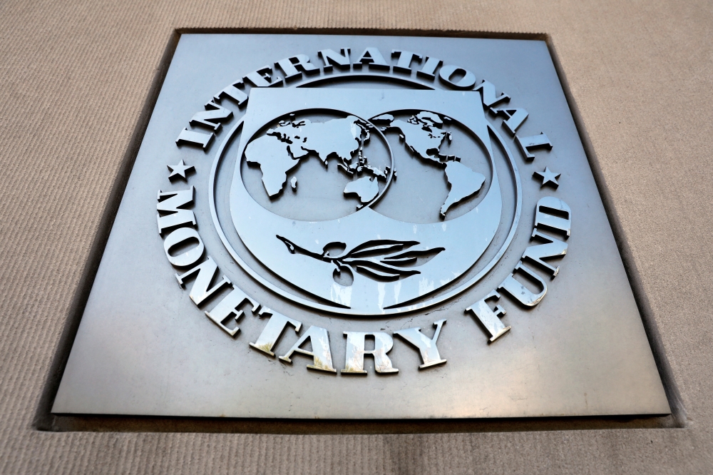 International Monetary Fund logo is seen outside the headquarters building during the IMF/World Bank spring meeting in Washington, U.S., April 20, 2018. REUTERS/Yuri Gripas/File Photo