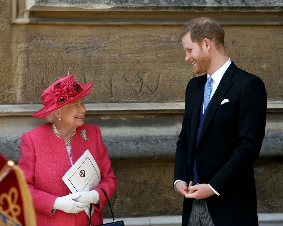 Queen Elizabeth II talks to Prince Harry as they leave after the wedding of Lady Gabriella Windsor and Thomas Kingston at St George's Chapel in Windsor Castle, near London, Britain May 18, 2019. Steve Parsons/Pool via REUTERS/

