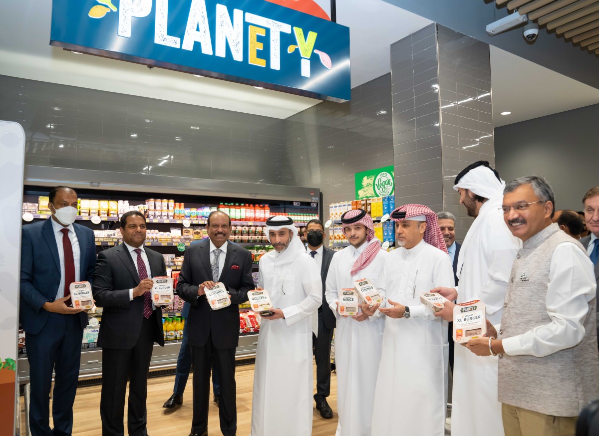 Officials holding products during the tour of the Hypermarket.  