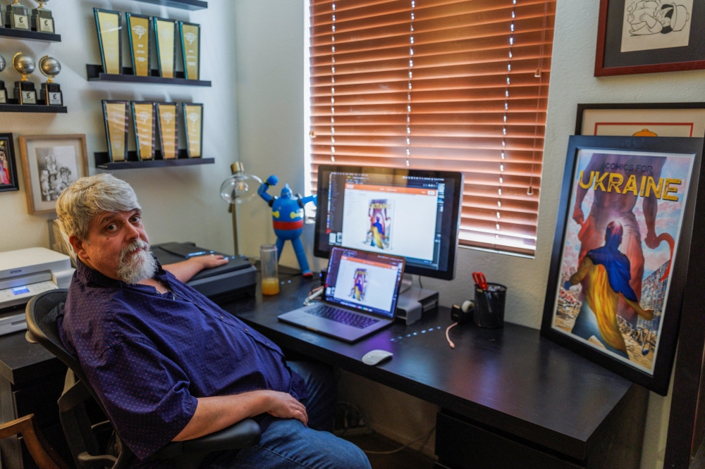 Scott Dunbier, who has gathered comic book artists from around the world to create a book about the war in Ukraine as he helps raise money for Ukraine refugees, looks on from his home in San Marcos, California, U.S., April 19, 2022. Picture taken April 19, 2022. REUTERS/Mike Blake
 