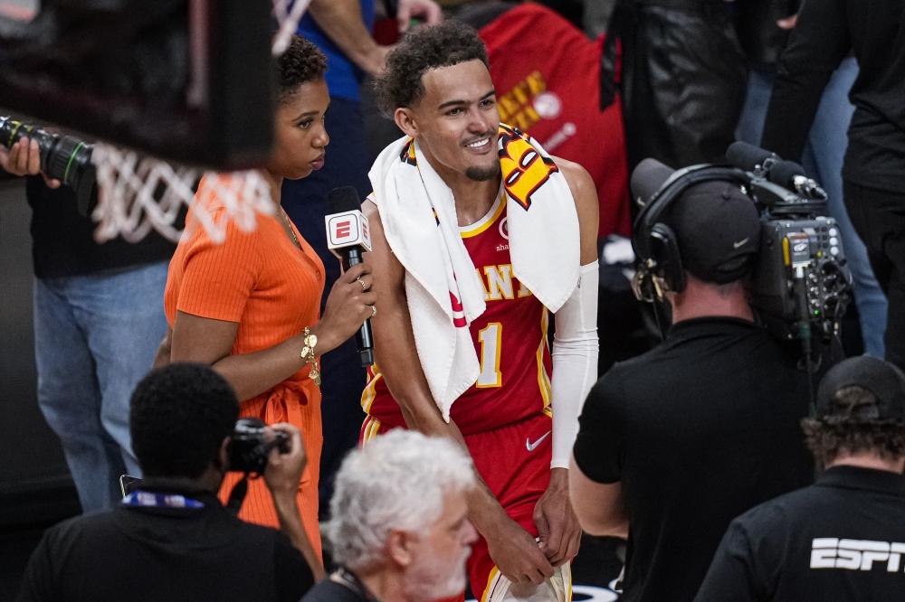 Atlanta Hawks guard Trae Young (11) reacts before being interviewed after the Hawks defeated the Miami Heat in game three of the first round for the 2022 NBA playoffs at State Farm Arena. Mandatory Credit: Dale Zanine