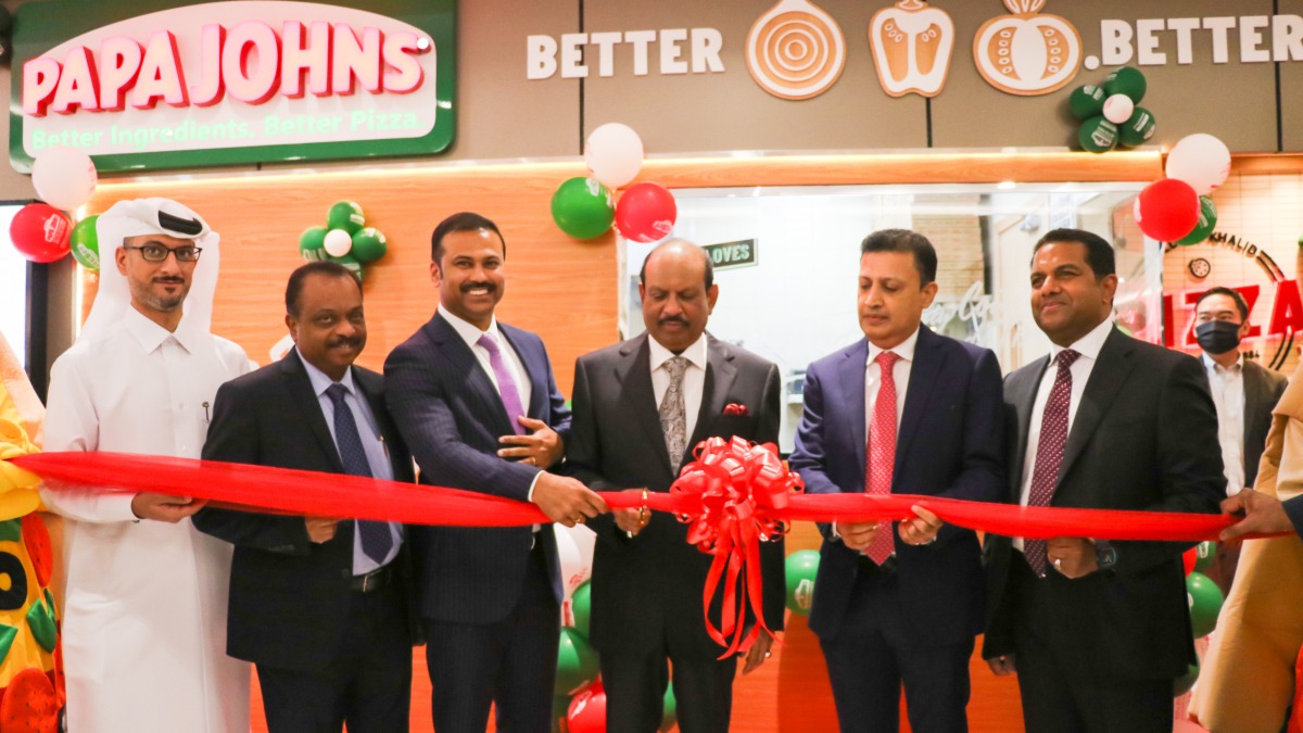 Officials cut the ribbon at Lulu Ain Khaled to open the 39th Papa John's outlet in Qatar.