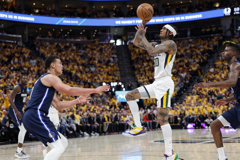 Utah Jazz guard Jordan Clarkson (00) shoots the ball against Dallas Mavericks center Dwight Powell (7) during the third quarter in game four of the first round for the 2022 NBA playoffs at Vivint Arena. Utah Jazz won 100-00.Chris Nicoll