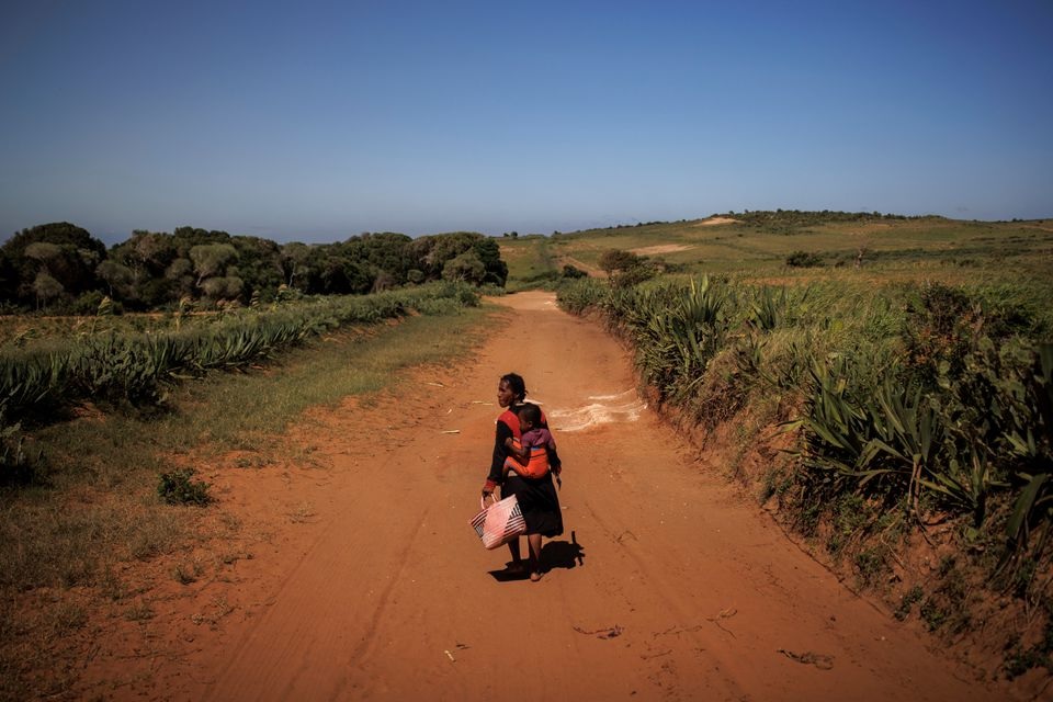 Kazy Zanapizo walks to her field in the village of Ambory, Erada commune, Androy region, Madagascar, February 16, 2022. Picture taken February 16, 2022. REUTERS/Alkis Konstantinidis


