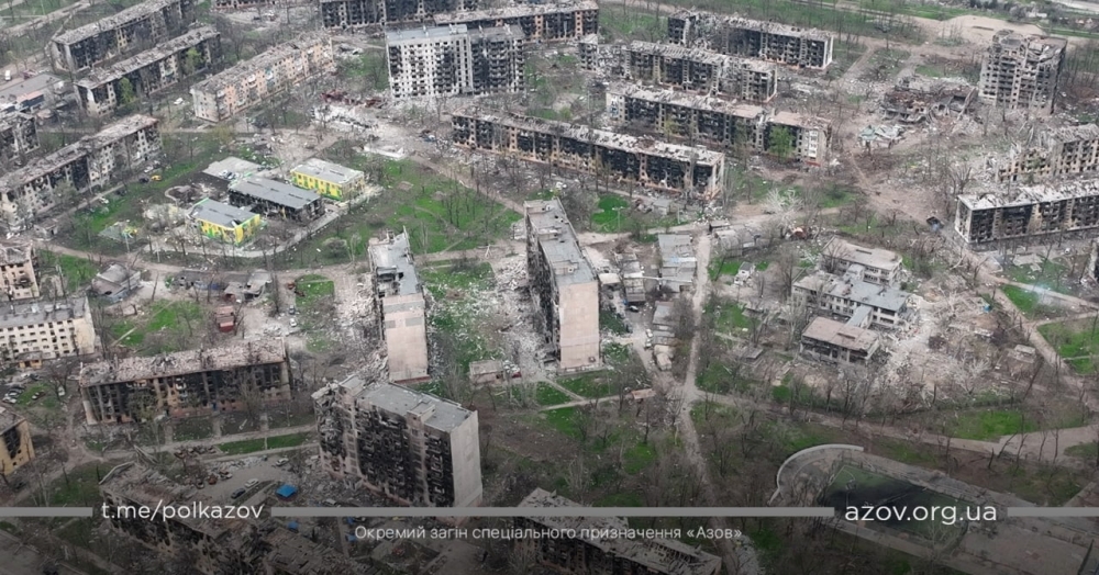 An aerial view shows damaged buildings, amid Russia's ongoing invasion of Ukraine, in Mariupol, Ukraine in this handout picture taken with a drone released April 24, 2022. Azov/Handout via REUTERS