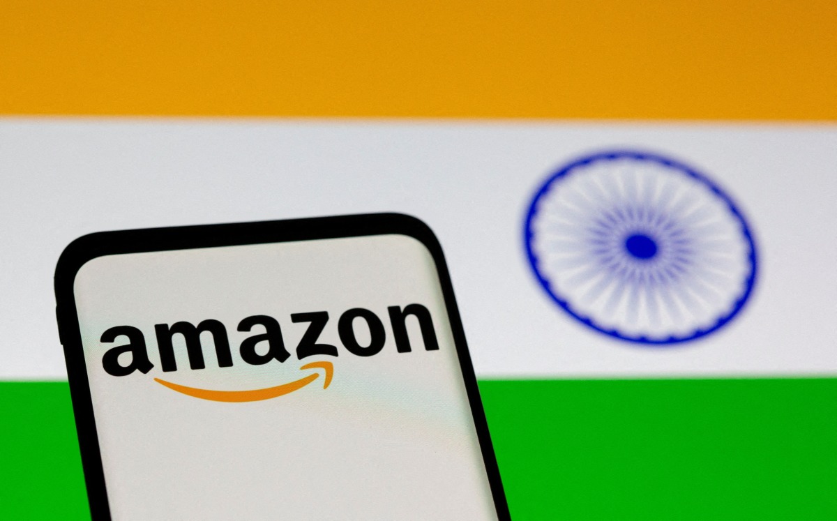 FILE PHOTO: Smartphone with Amazon logo is seen in front of displayed Indian flag in this illustration taken, July 30, 2021. REUTERS/Dado Ruvic/File Photo
