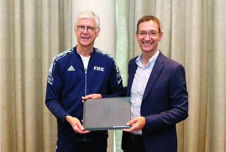 Aspire Academy Director General Ivan Bravo (right) and FIFA’s Chief of Global Football Development Arsène Wenger pose for a photo. 