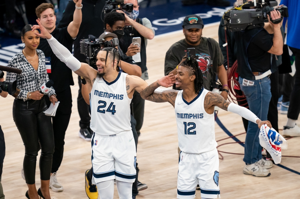 Memphis Grizzlies forward Dillon Brooks (24) and guard Ja Morant (12) celebrate after the game against the Minnesota Timberwolves after game six of the first round for the 2022 NBA playoffs at Target Center. Mandatory Credit: Brad Rempel
