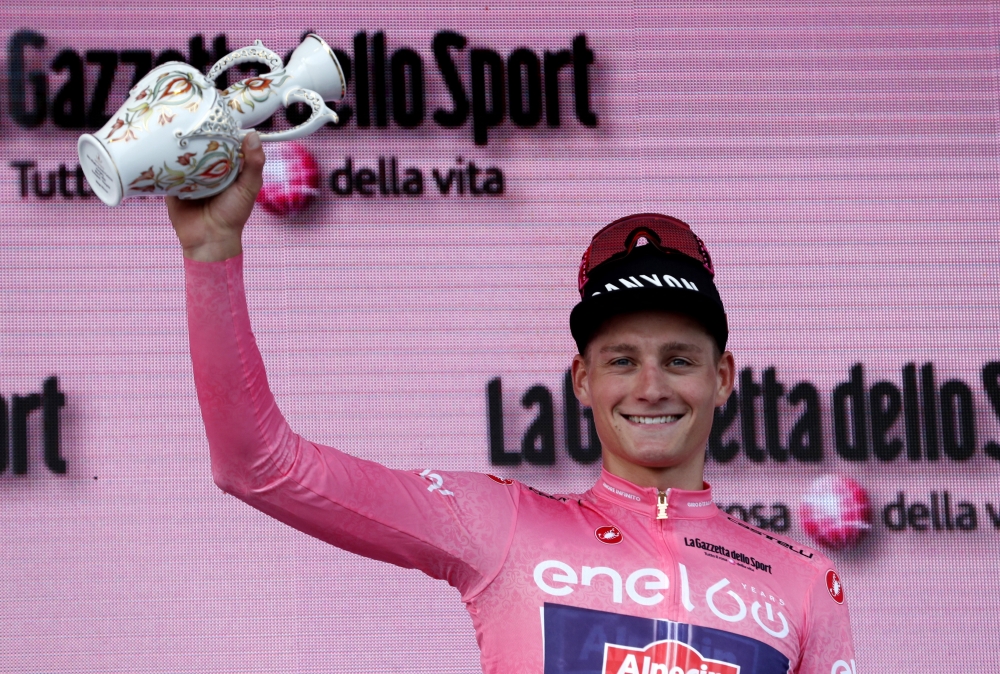 May 6, 2022 Alpecin-Fenix's Mathieu Van Der Poel celebrates on the podium wearing the maglia rosa jersey REUTERS/Bernadett Szabo