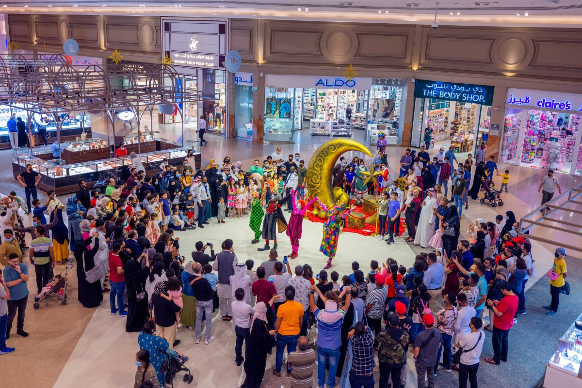 Visitors enjoy a performance to celebrate Eid Al Fitr at Hyatt Plaza mall.  