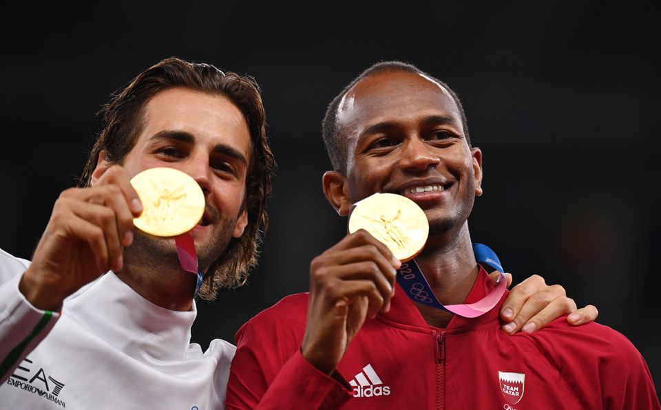 Gold medallists, Gianmarco Tamberi of Italy and Mutaz Essa Barshim of Qatar celebrate on the podium during the Tokyo Olympic Games, in this August 2, 2021 file photo.