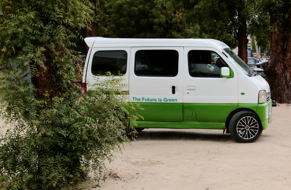 A solar battery-powered minibus is driven out of a charging station along Baga-Kazuwa road in Maiduguri, Nigeria May 4, 2022. REUTERS/Afolabi Sotunde