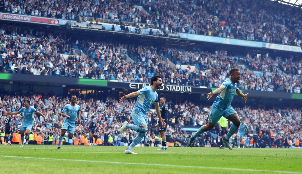 Manchester City's Ilkay Gundogan celebrates scoring their third goal with Gabriel Jesus REUTERS/Hannah Mckay