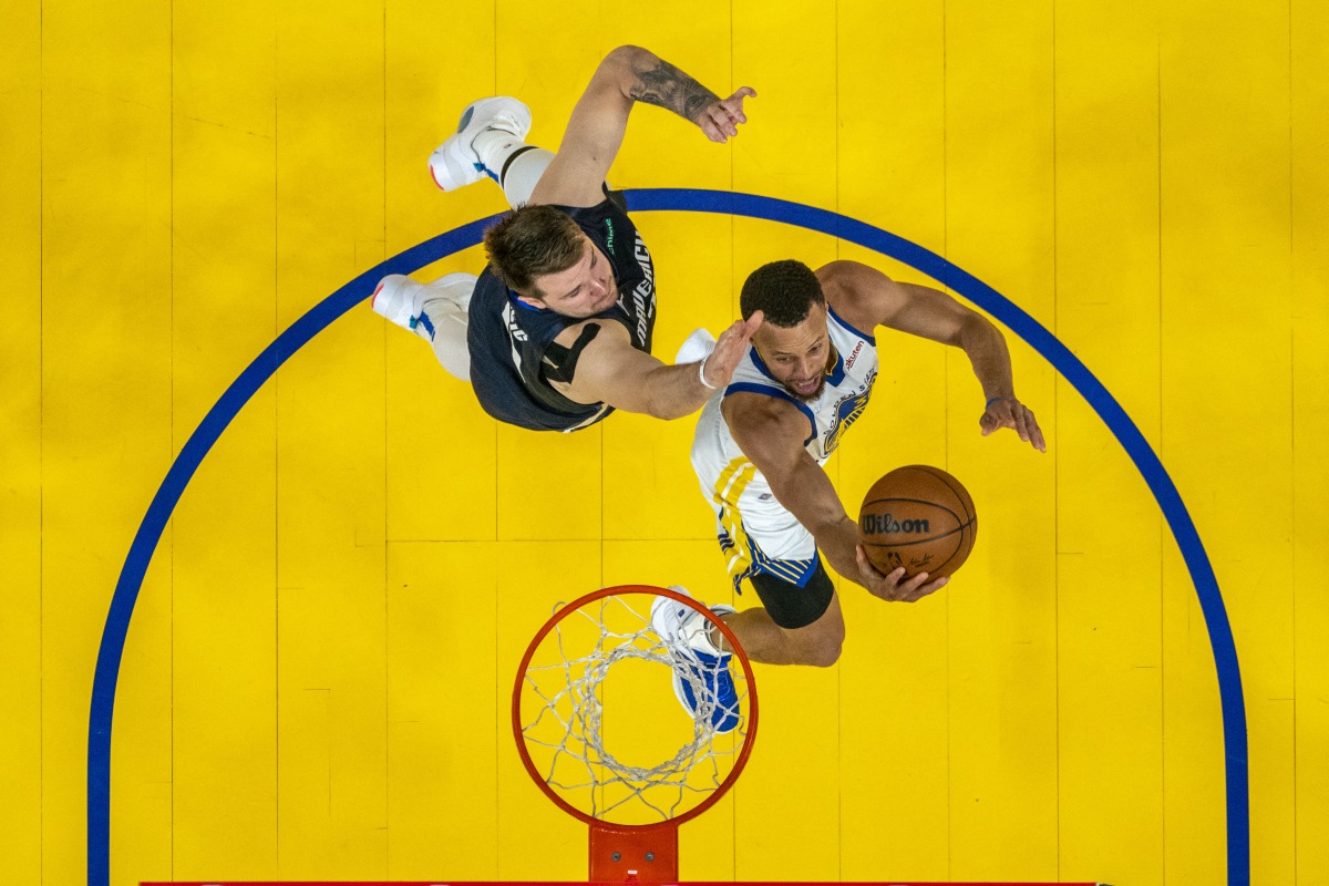 Golden State Warriors guard Stephen Curry (30) shoots the basketball against Dallas Mavericks guard Luka Doncic (77) during the second half in game two of the 2022 western conference finals at Chase Center. Mandatory Credit: Kyle Terada-USA TODAY Sports
