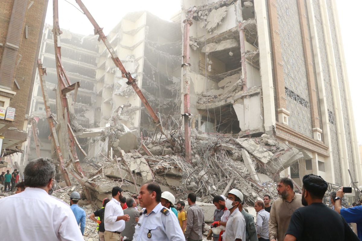 Iranians gather at the site of a ten-storey building collapse in Abadan, Iran May 23, 2022. WANA (West Asia News Agency) via REUTERS ATTENTION EDITORS - THIS IMAGE HAS BEEN SUPPLIED BY A THIRD PARTY.
