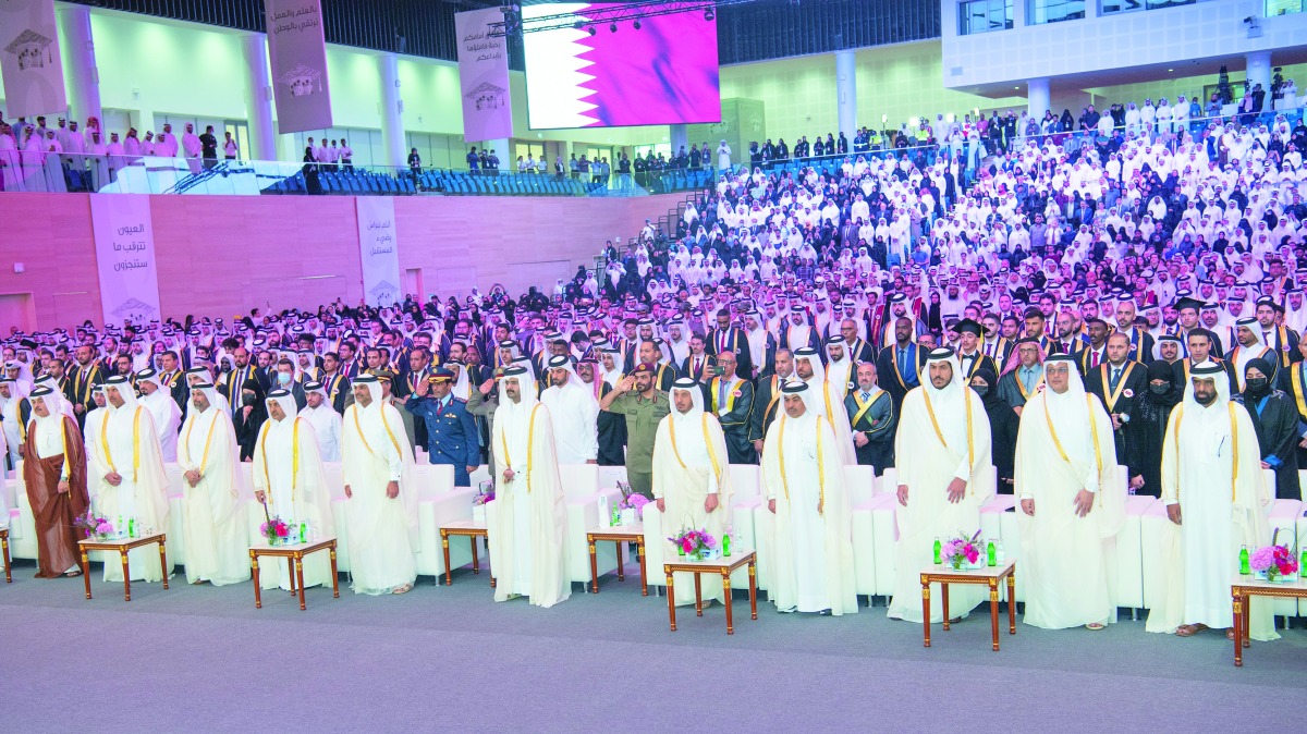 Deputy Amir H H Sheikh Abdullah bin Hamad Al Thani attending the the graduation ceremony of Qatar University's 45th batch at the QU Sport and Events Complex, yesterday.