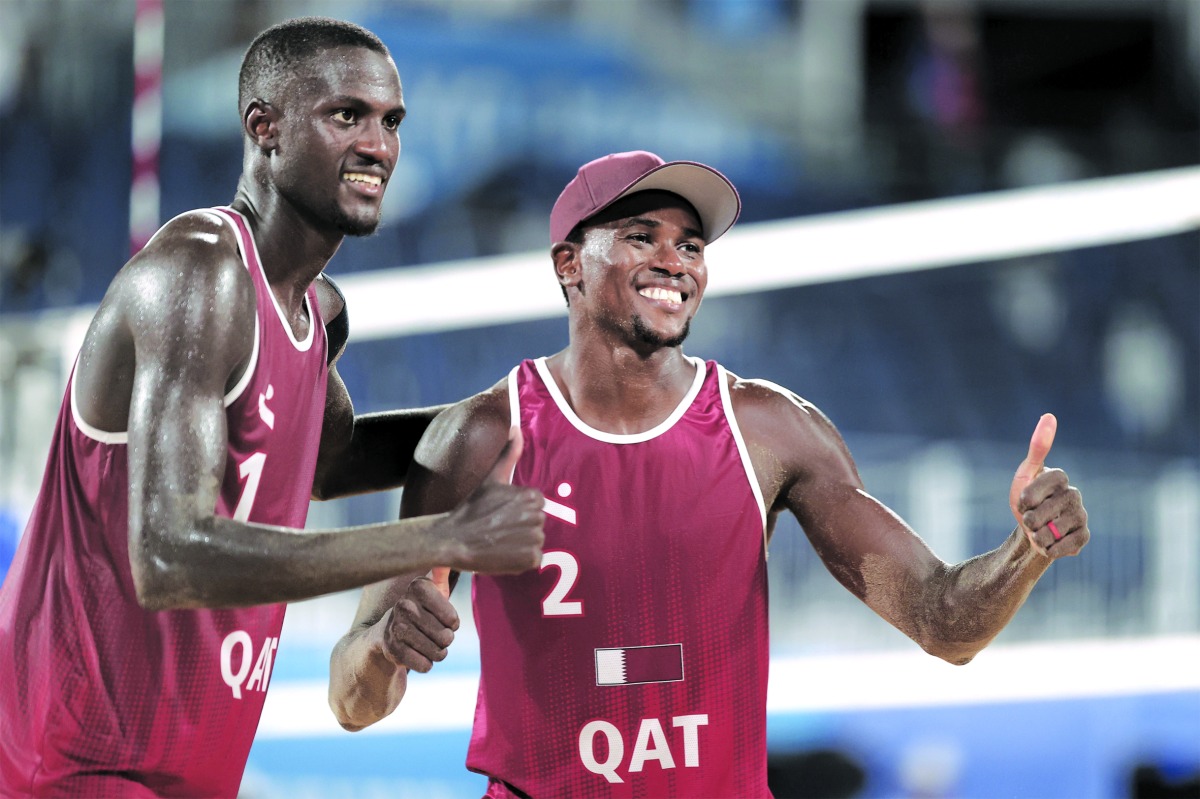 Qatar's Cherif Younousse and Ahmed Tijan.