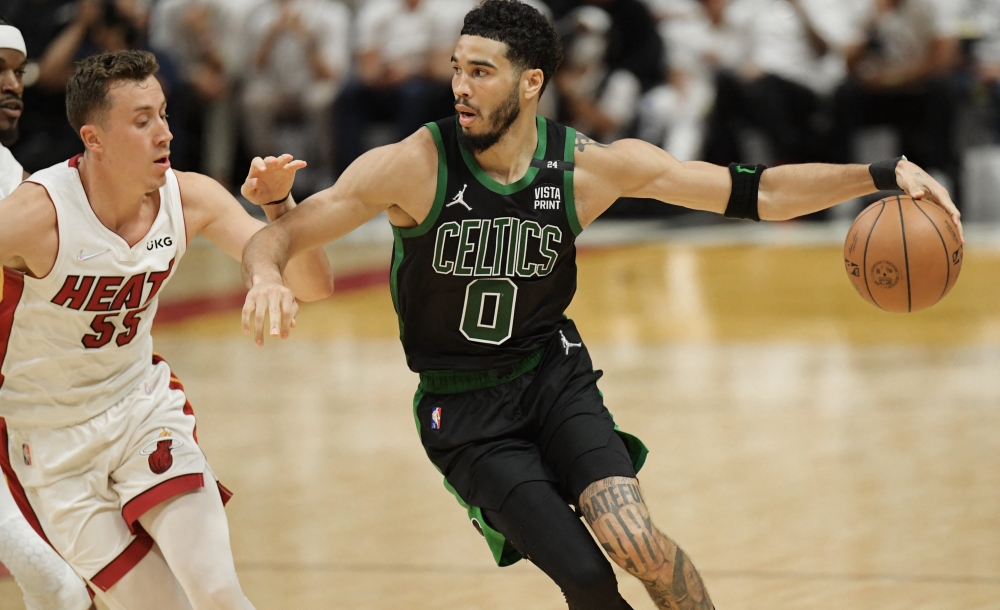 Boston Celtics forward Jayson Tatum (0) drives to the basket against Miami Heat guard Duncan Robinson (55) during the second half of game five of the 2022 eastern conference finals at FTX Arena.Jim Rassol