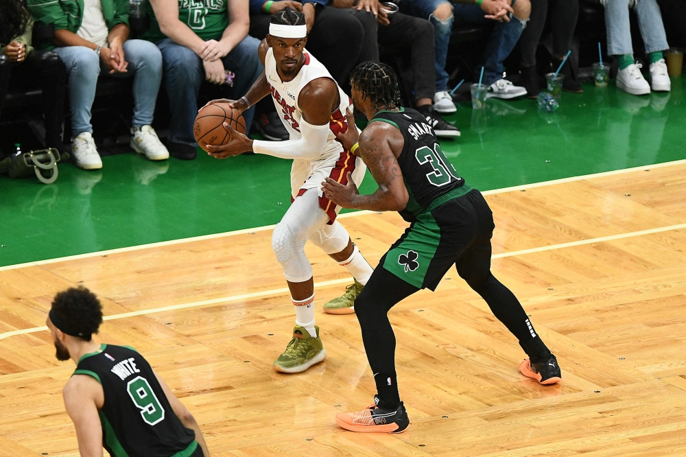 Miami Heat forward Jimmy Butler (22) controls the ball against Boston Celtics guard Marcus Smart (36) during the second half in game six of the 2022 eastern conference finals at TD Garden. Brian Fluharty
