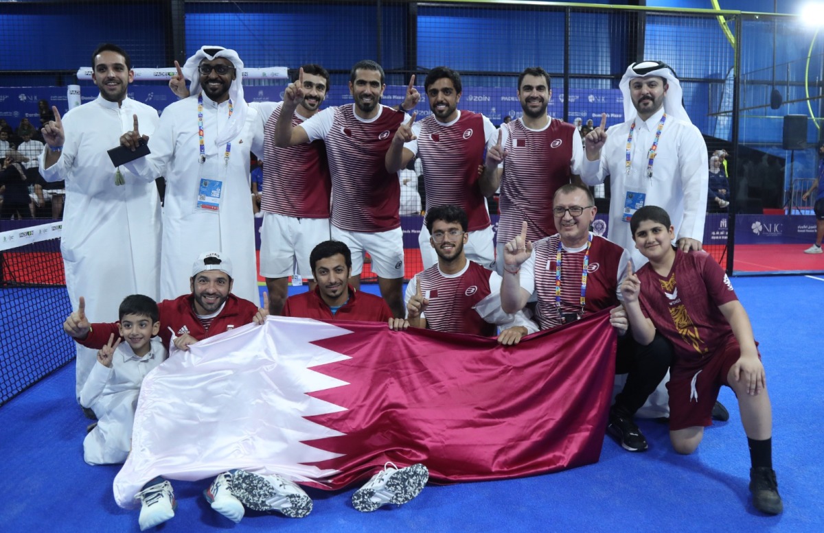 Qatar padel players and officials celebrate after winning the gold medal.