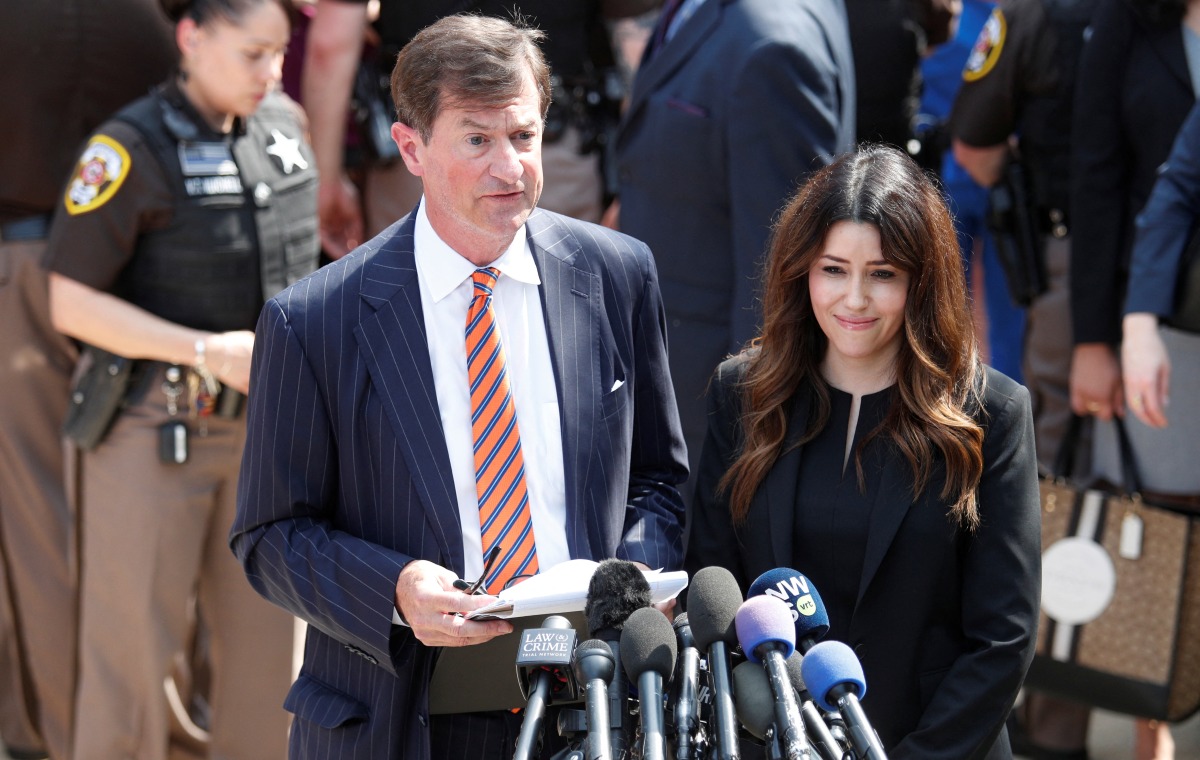 Johnny Depp's attorneys Benjamin Chew and Camille Vasquez speak to the media after the jury announced split verdicts in favor of both Johnny Depp and his ex-wife Amber Heard on their claim and counter-claim in the Depp v. Heard civil defamation trial at the Fairfax County Circuit Courthouse in Fairfax, Virginia, U.S., June 1, 2022. REUTERS/Tom Brenner
