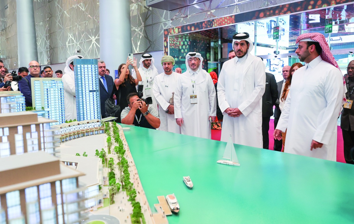 Minister of Commerce and Industry, H E Sheikh Mohammed bin Hamad bin Qassim Al Abdullah Al Thani, Qatari Diar CEO Eng. Abdullah bin Hamad Al Attiyah and Manateq CEO Fahad Rashid Al Kaabi touring the event after the inauguration.