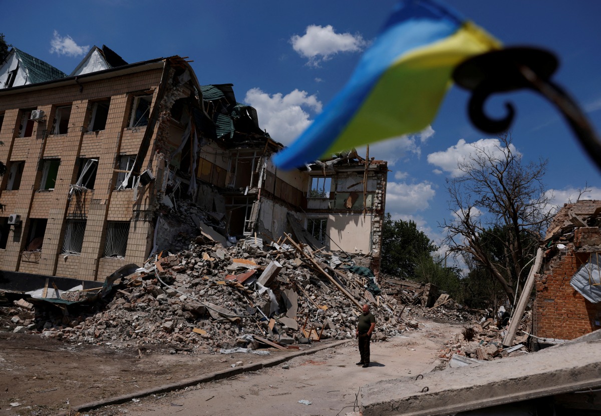 Press officer Olexii Mischenko shows a destroyed city administration building in Bashtanka, Mykolaiv region, as Russia's attack on Ukraine continues, Ukraine June 9, 2022. REUTERS/Edgar Su