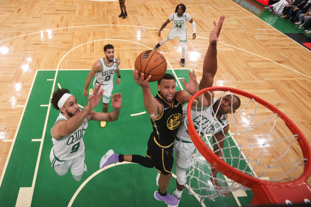 Golden State Warriors guard Stephen Curry (30) attempts a layup against Boston Celtics center Al Horford (42) during the first quarter of game four in the 2022 NBA Finals at the TD Garden. Elsa/Pool Photo-USA TODAY Sports