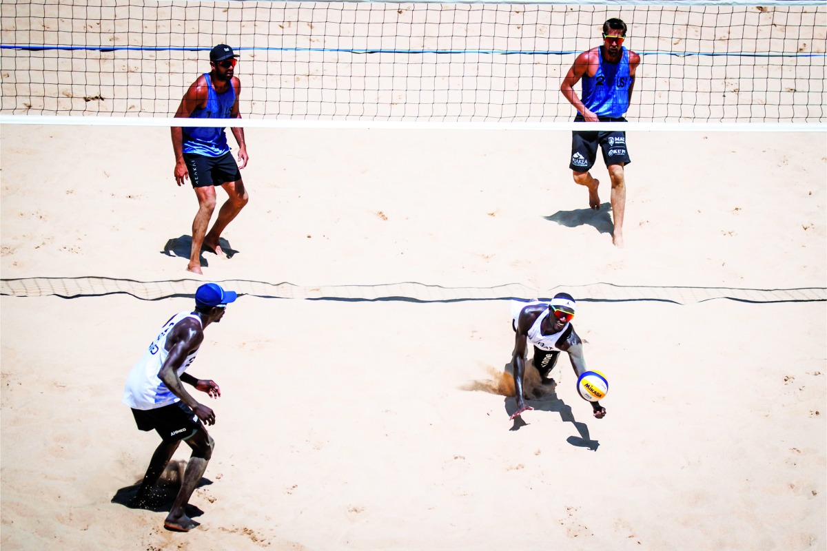 Qatar's Cherif Younousse (right) and Ahmed Tijan in action yesterday.