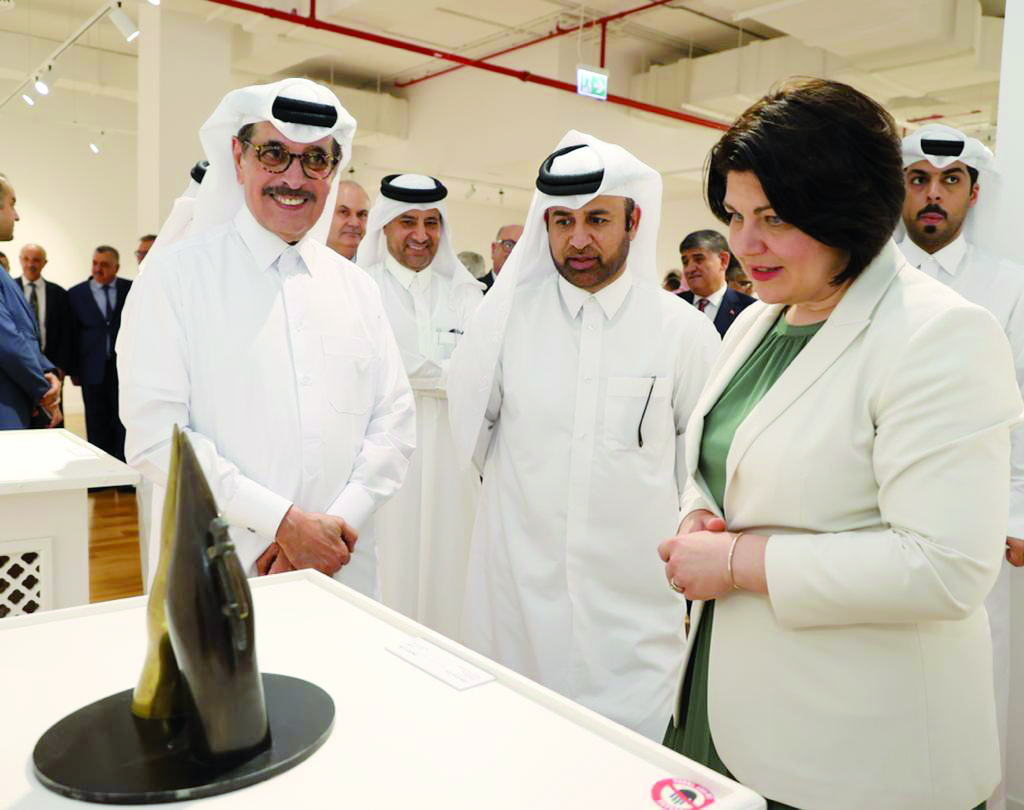 Minister of State and Head of Qatar National Library H E Dr. Hamad bin Abdulaziz Al Kuwari (left), Prof Dr. Khalid bin Ibrahim Al Sulaiti, General Manager of the Cultural Village Foundation, Katara (centre), and Prime Minister of the Republic of Moldova H E Natalia Gavrilita (right) during the opening of the exhibition, Image of the World in Stone and Metal, at Katara.