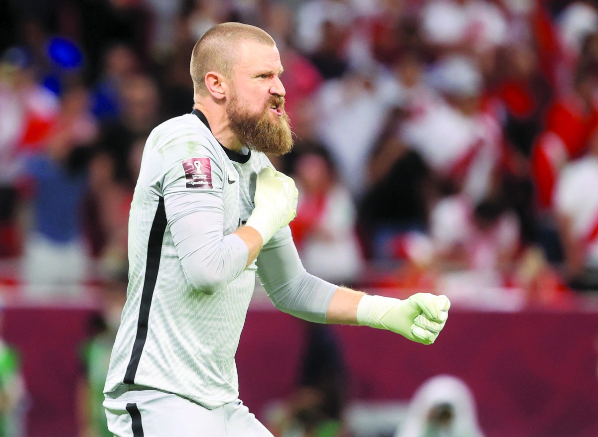 Australia’s Andrew Redmayne celebrates after saving a penalty during the shootout.