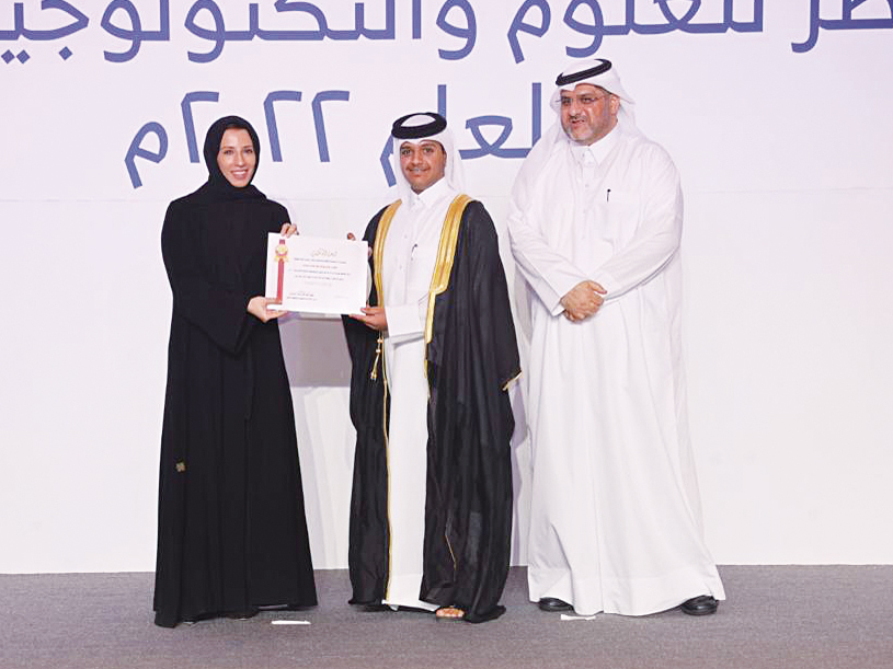 Minister of Education and Higher Education H E Buthaina bint Ali Al Jabr Al Nuaimi presenting graduation certificate to a QSTSS graduate. 