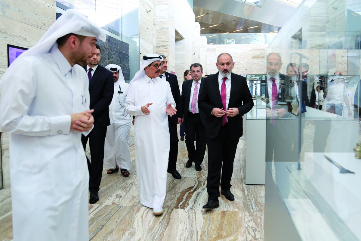 Minister of State and President of QNL H E Dr. Hamad bin Abdulaziz Al Kawari, , and Prime Minister of Armenia H E Nikol Pashinyan, during a tour of the Qatar National Library, yesterday.