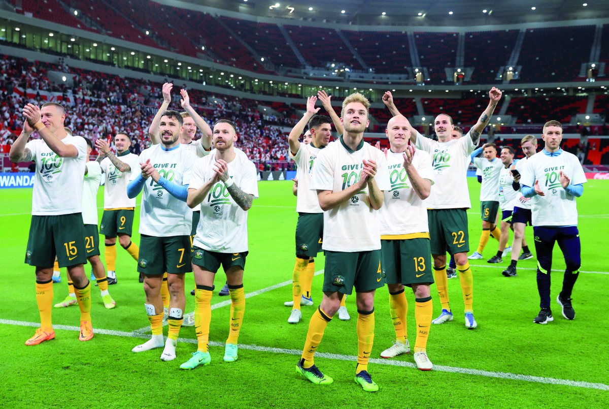 Australia players celebrate after qualifying for FIFA World Cup Qatar 2022 