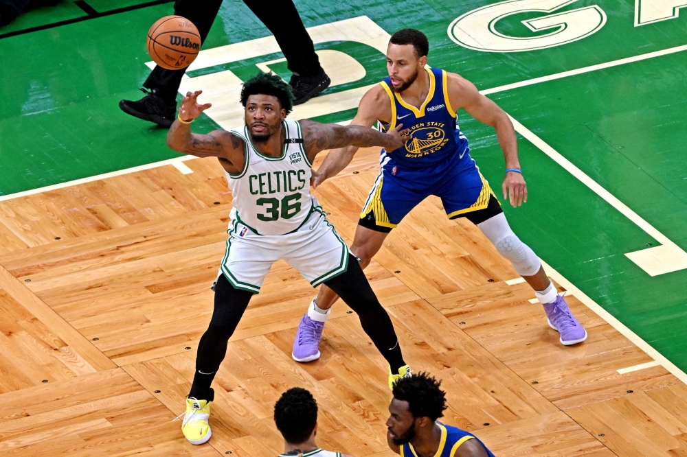 Boston Celtics guard Marcus Smart (36) handles the ball against Golden State Warriors guard Stephen Curry (30) during the first quarter in game six of the 2022 NBA Finals at TD Garden. Bob DeChiara-USA TODAY Sports