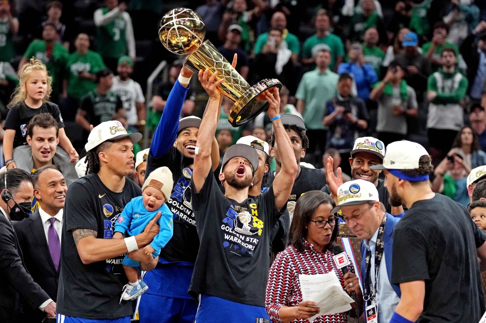 Golden State Warriors guard Stephen Curry (30) celebrates with the Larry O'Brien Championship Trophy after the Golden State Warriors beat the Boston Celtics in game six of the 2022 NBA Finals to win the NBA Championship at TD Garden. Kyle Terada-USA TODAY Sports